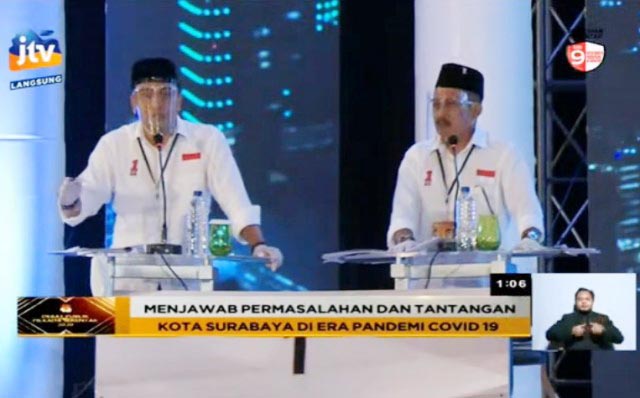 TAMPIL TENANG: Eri Cahyadi dan Armuji, tampil tenang tapi kaya data dalam debat perdana Pilwali Surabaya. | Foto: IST/JTV